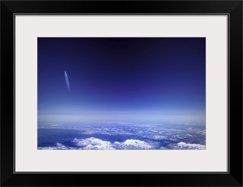 Aircraft vapour trails above clouds over Colorado