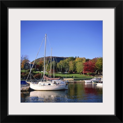 Boats on waterfront at Camden harbour with Mount Battie, Maine, USA