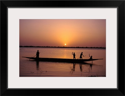 Children on local pirogue or canoe on the Bani River at sunset at Sofara, Mali, Africa