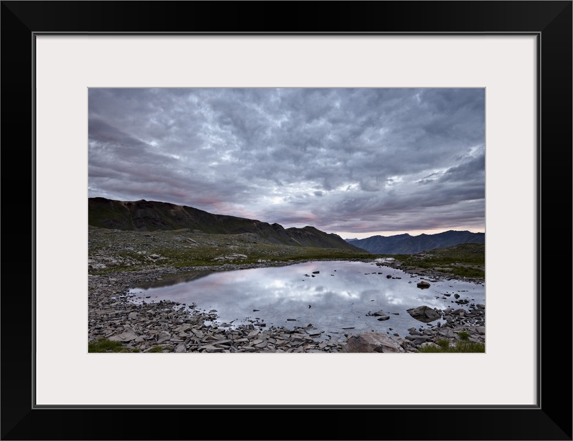 Clouds reflected in a tarn at Stony Pass, San Juan National Forest, Colorado