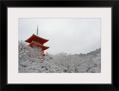 Kiyomizu-dera Temple's pagoda hiding behind snow-covered trees, Kyoto, Japan