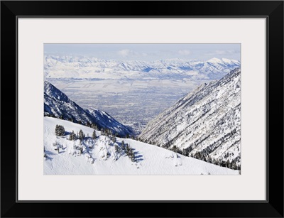 Salt Lake Valley and fresh powder tracks at Alta, Alta Ski Resort, Salt Lake City, Utah