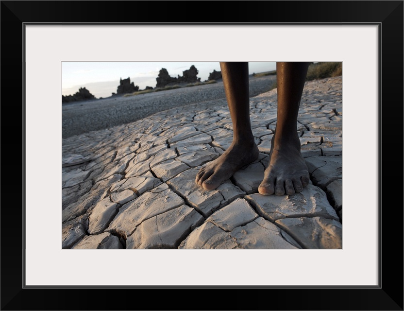 Standing in the desolate landscape of Lac Abbe, Djibouti, Africa