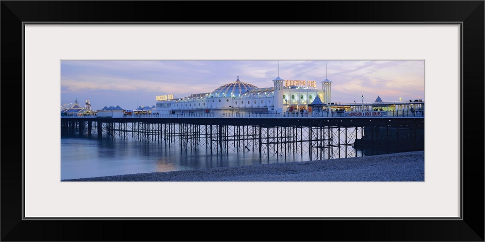 The beach and Palace Pier, Brighton, East Sussex, England, UK, Europe