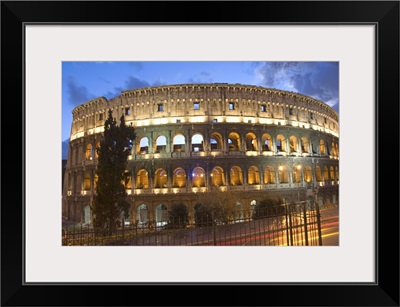 The Colosseum at night with traffic trails, Rome, Lazio, Italy