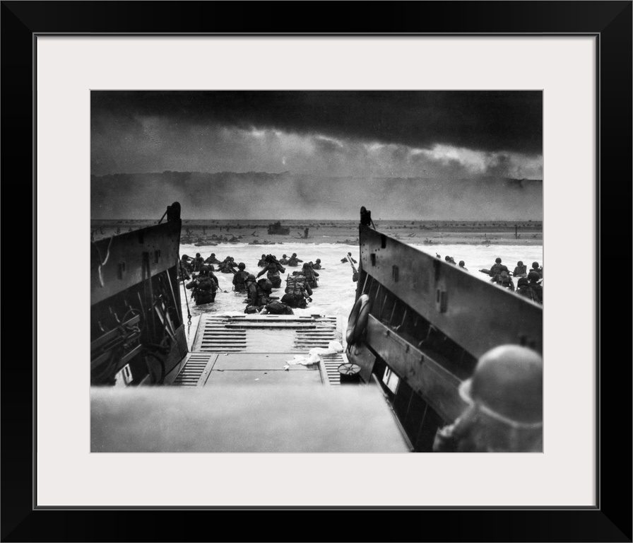 D-Day landings. US Coast Guard-manned LCVP disembarking troops on the morning of 6 June 1944 at Omaha Beach in one of the ...
