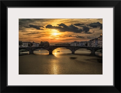 Bridge over the Arno River at sunset in Florence, Italy