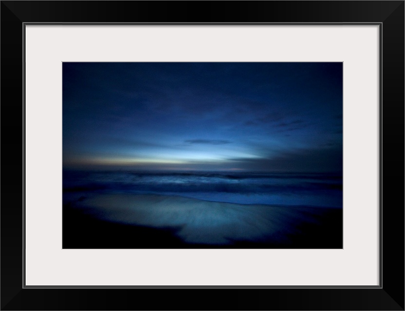 Landscape, oversized photograph of deep blue ocean waters along the beach, surrounded by the darkness of dusk in Big Sur, ...