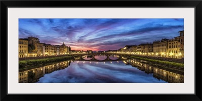Panorama over the Arno River at sunset in Florence, Italy