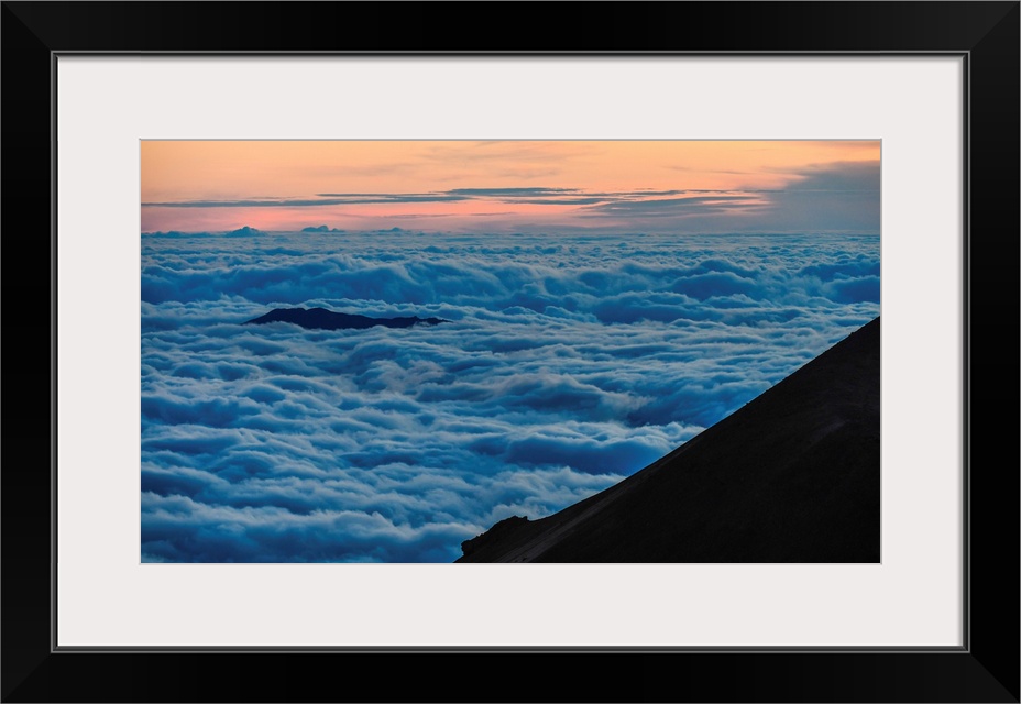 Big Island Hawaii. Clouds roll in along the slopes of the Mauna Kea volcano on Hawaii's big island.