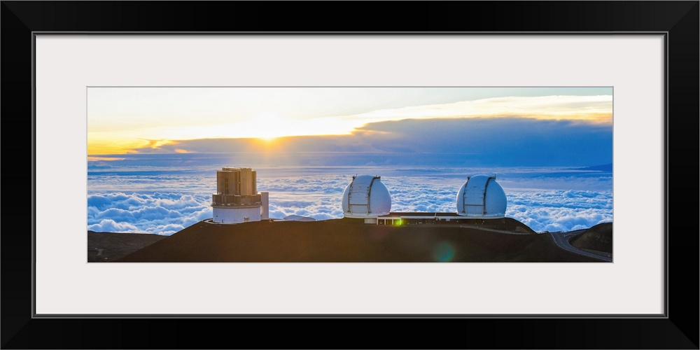 Big Island Hawaii. The sun sets over the observatories on Mauna Kea.