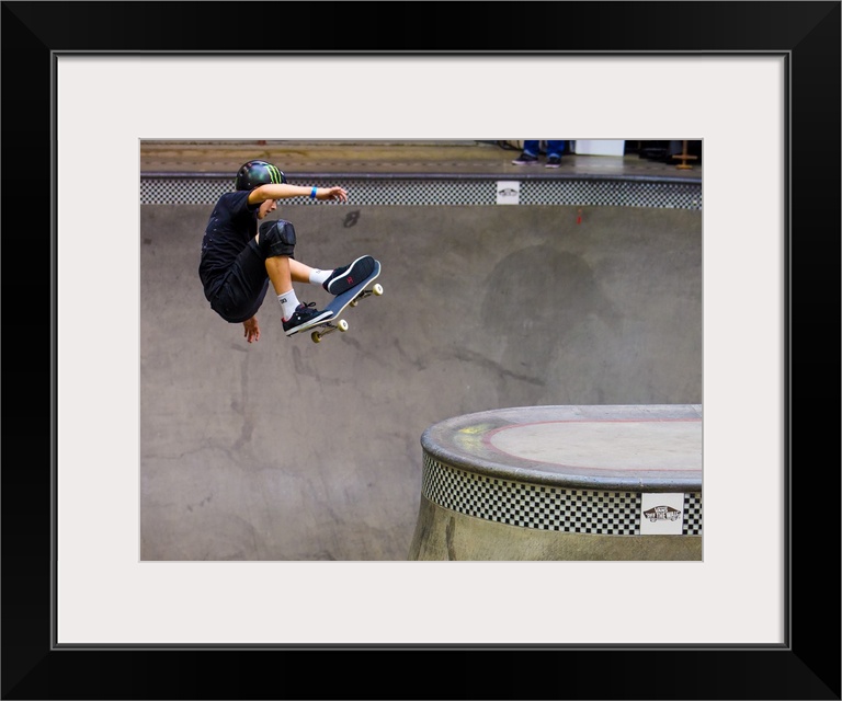 Tom Schaar jumping on his skateboard at Vans Off The Wall Skatepark in Huntington Beach, California, 2016.