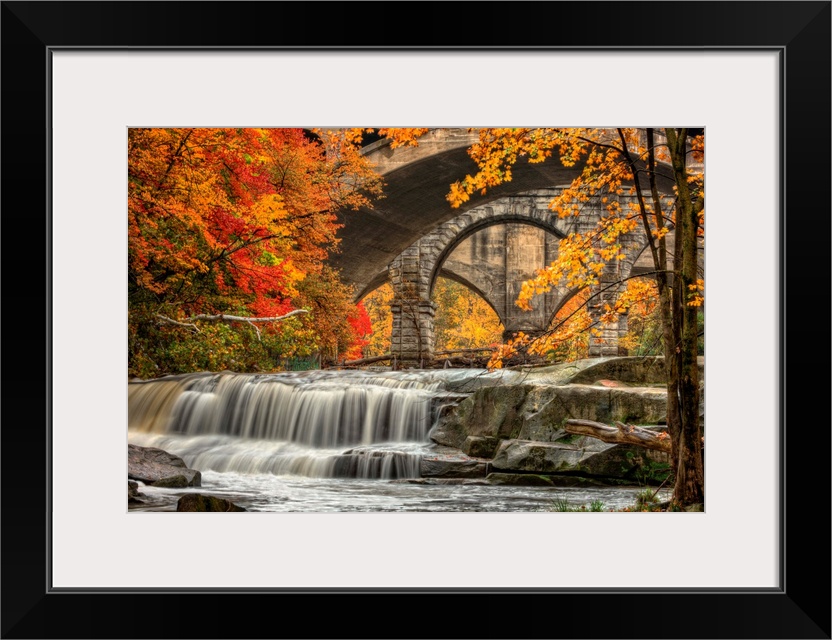 Berea Falls, Ohio, during peak fall colors. This cascading waterfall looks it's best with peak autumn colors in the trees....