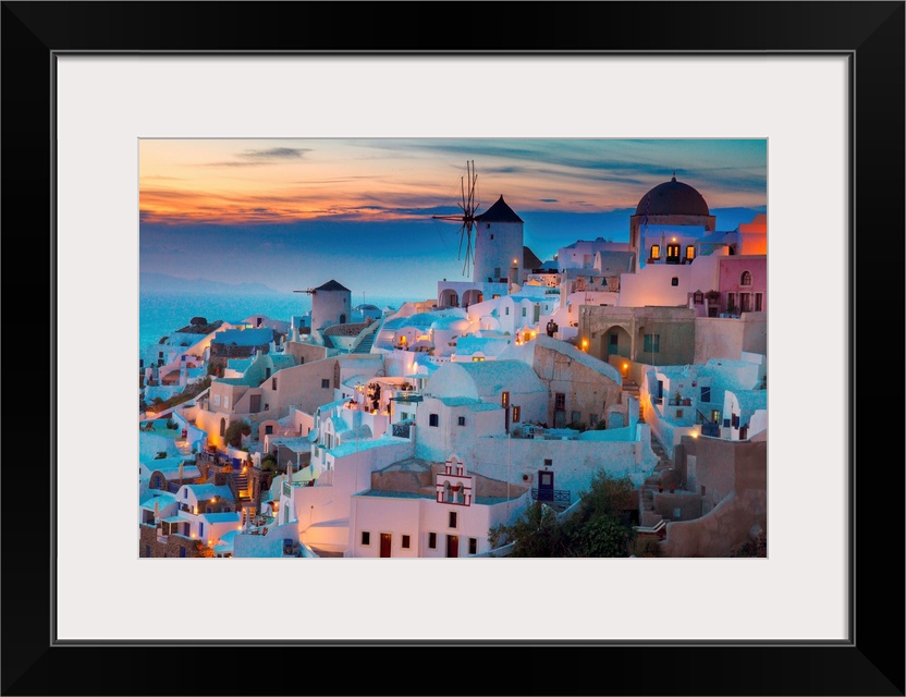 Lights of Oia village at night, Santorini, Greece.