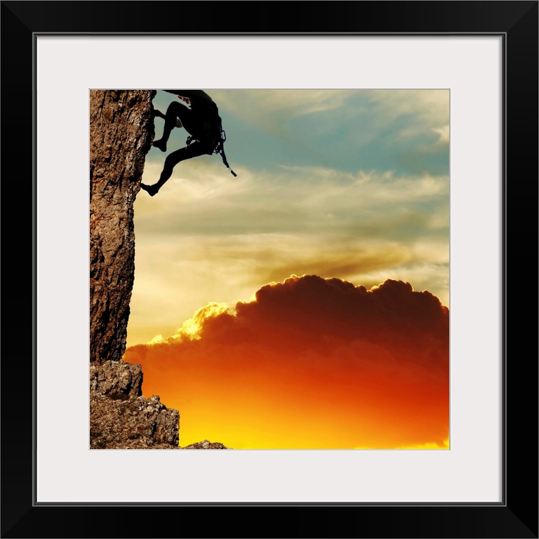 girl climbing on the rock on sunset background