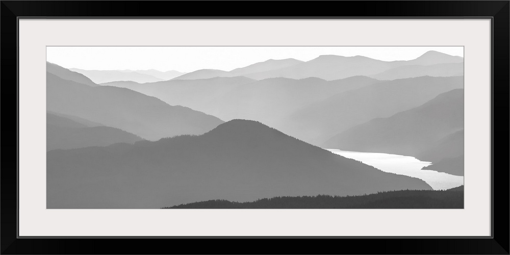 Black and white image of many layers of mountain range in the Monashee Mountains, Canada.