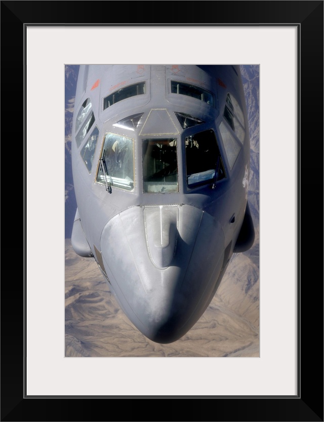 A B-52 Stratofortress bomber refuels during a close-air-support mission.