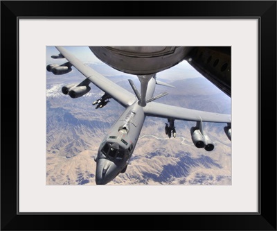 A B52 Stratofortress receives fuel from a KC135 Stratotanker over Afghanistan