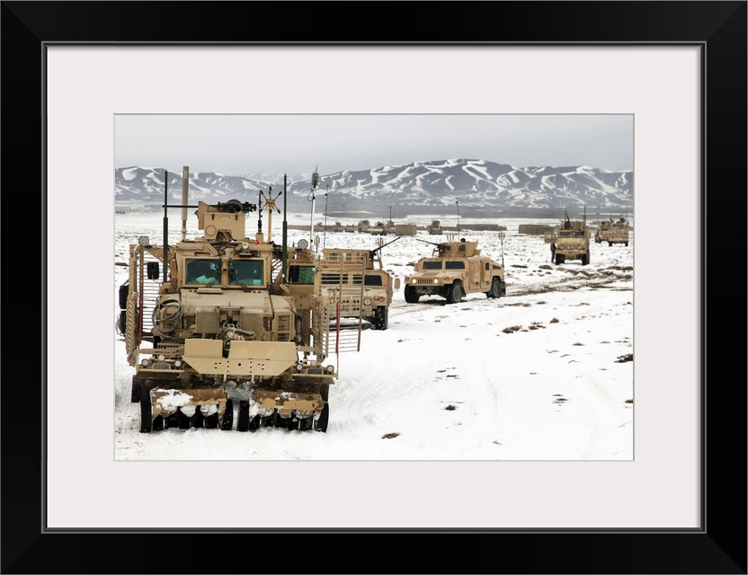 February 10, 2011 - U.S. Army soldiers travel down Route Dodge during a route clearing procedure, Paktika province, Afghan...