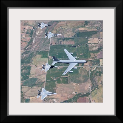 A KC-135R Stratotanker refuels four F-15 Eagles over Oregon