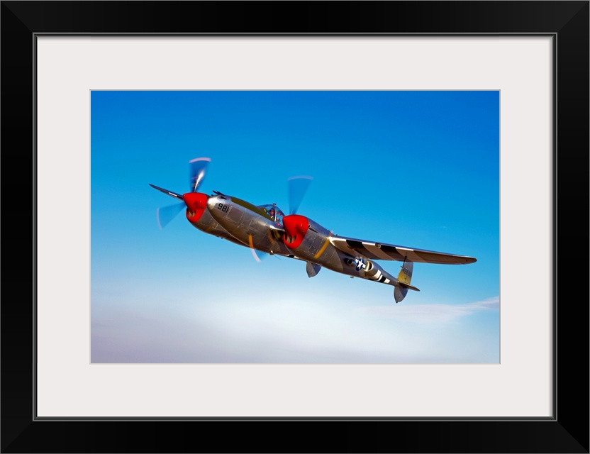 A Lockheed P-38 Lightning fighter aircraft in flight near Chino, California.