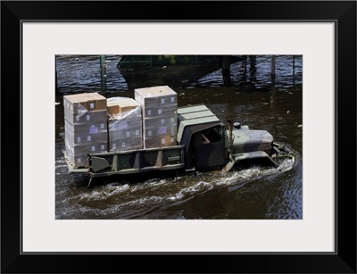 A National Guard M817 5-Ton Dump Truck Fords The Floodwaters