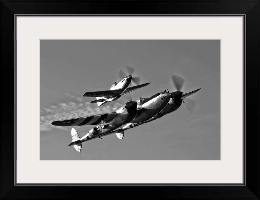 A P-38 Lightning and P-51D Mustang in flight over Chino, California.