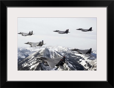 A sixship formation of aircraft fly over the Sawtooth Mountains in Idaho