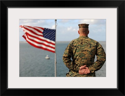 A soldier stands at attention on USS Bonhomme Richard