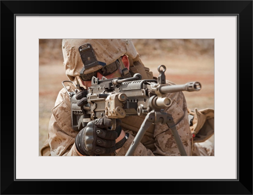 Horizontal photograph on a big canvas, taken at Marine Corps Base Hawaii, on July 30, 2010.  A squad automatic weapon gunn...
