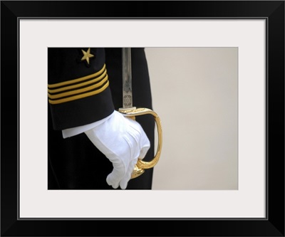 A U.S. Naval Academy midshipman stands at attention