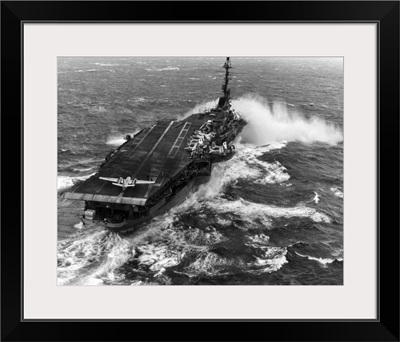 Aircraft Carrier USS Essex (CVA-9) Taking Spray Over The Bow In Heavy Seas
