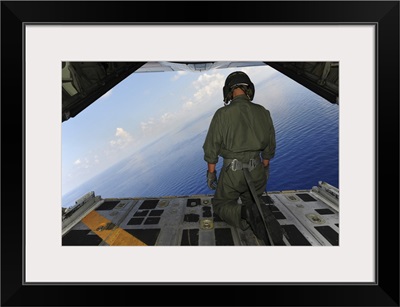 Airman Observes The Waters Of The Gulf Of Mexico From A C-130 Hercules