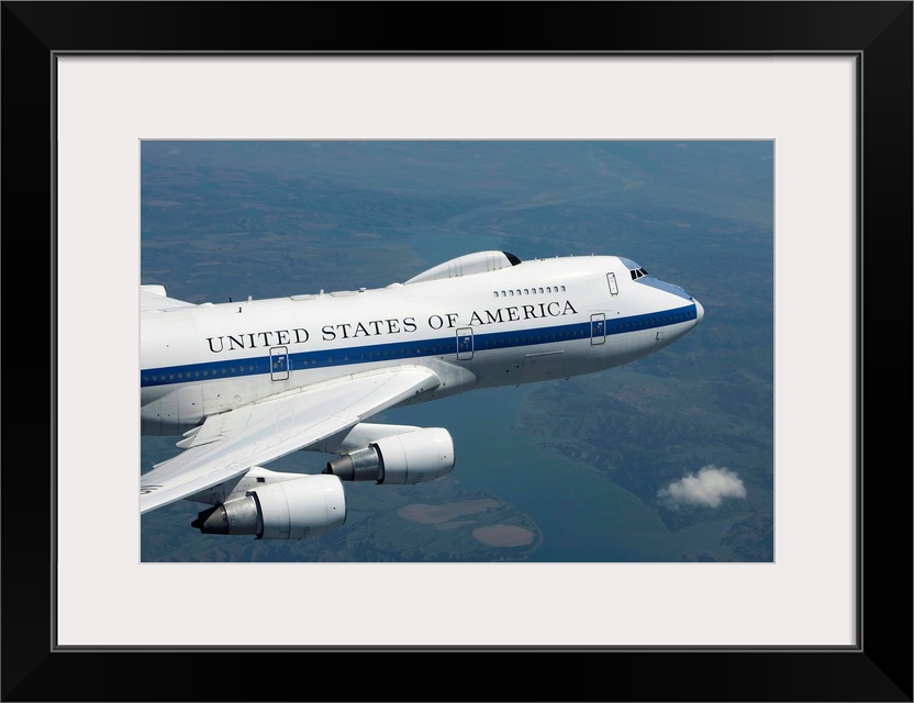 An E-4B National Airborne Operations Center (NAOC) aircraft flies high over the Midwest on a training mission out of Offut...