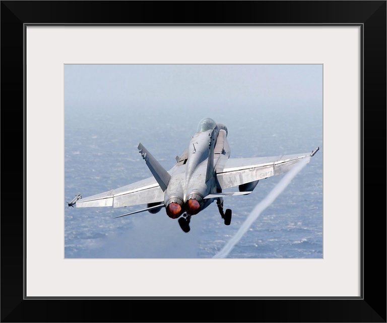 An F/A-18 Hornet taking off.