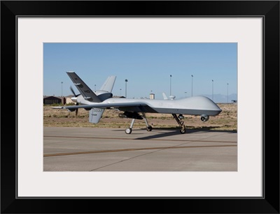 An MQ-9 Reaper taxies to the runway at Holloman Air Force Base