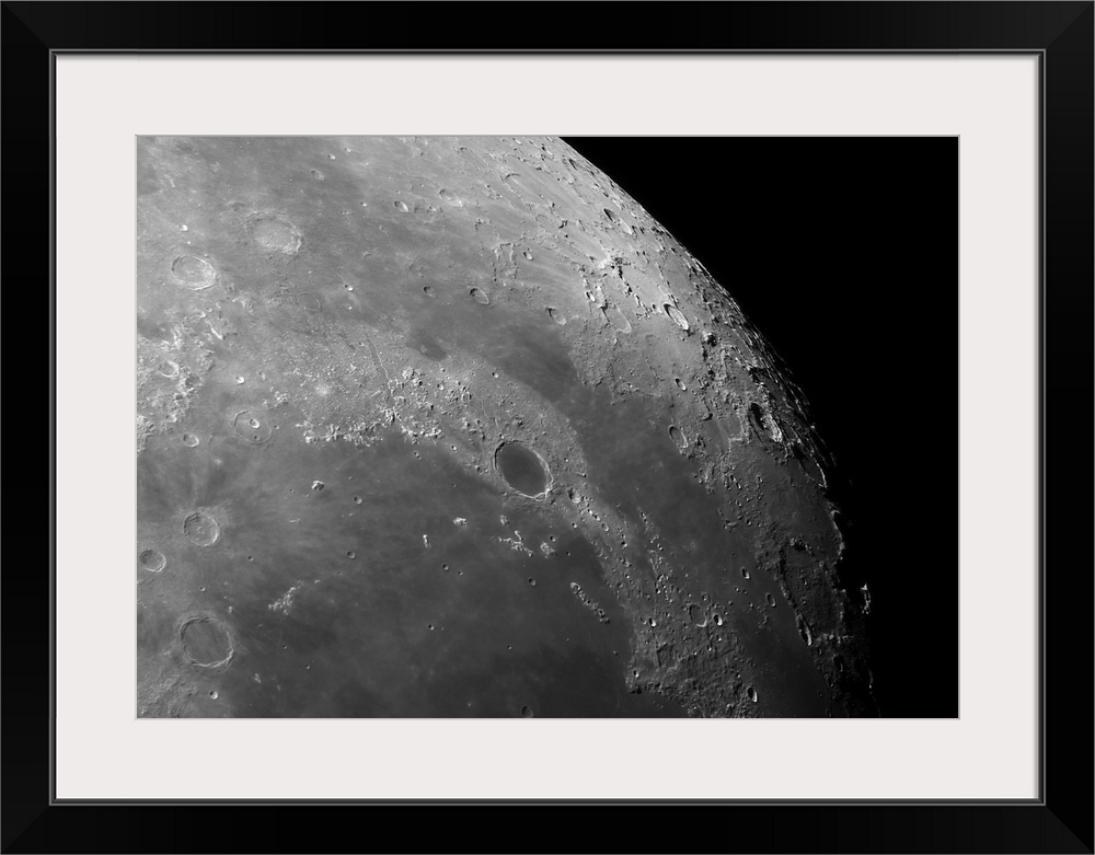 Close-up view of the moon showing impact crater Plato.