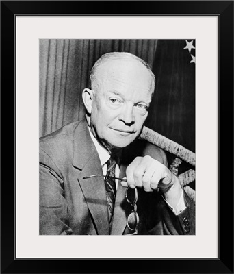 Digitally restored photo of Dwight Eisenhower holding a pair of glasses