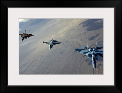 F15 Eagles and a F16 Fighting Falcon fly in formation