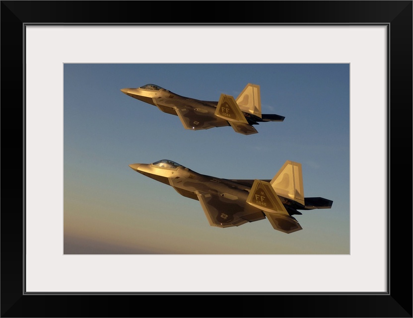 This wall art is a photograph of two United States Air Force twin-engine fighter aircrafts in flight.