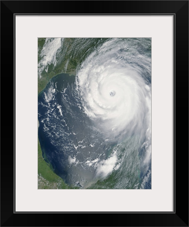 Big, vertical, aerial photograph of Hurricane Katrina swirling as she approaches land.