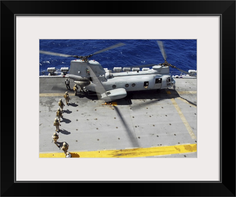 Pacific Ocean, October 21, 2008 -Marines load into a CH-46E Sea Knight helicopter for a fast-rope training exercise onto t...