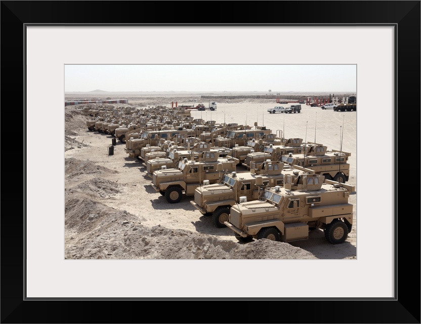Al Taqaddum, Iraq, September 4, 2007 - More than 30 Mine Resistant Ambush Protected vehicles sit in a lot here waiting for...