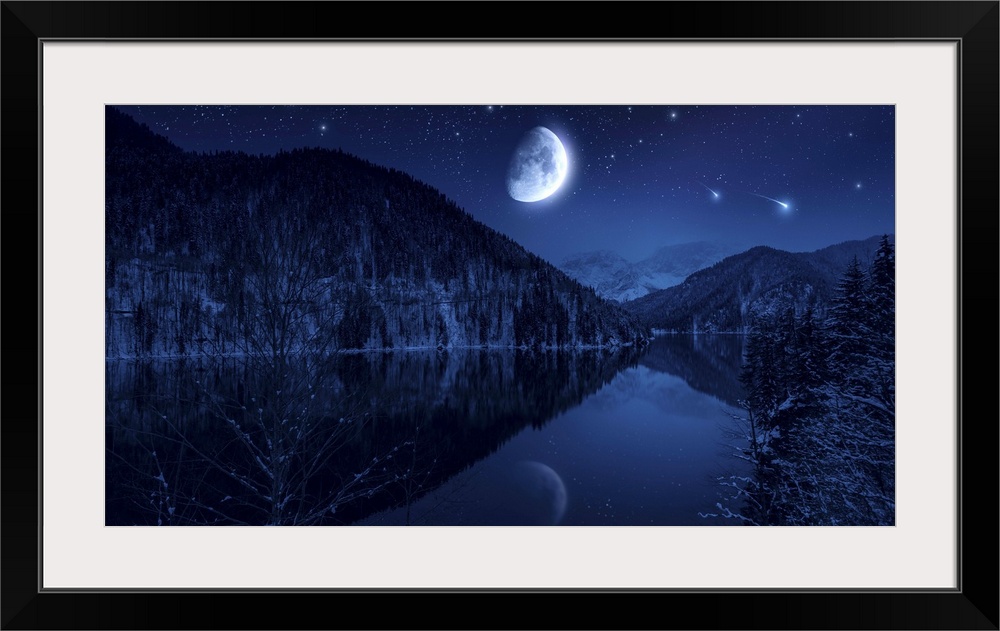 Moon rising over tranquil lake in the misty mountains against starry sky.