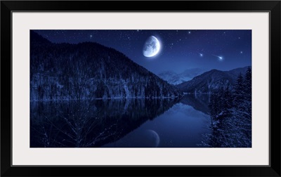 Moon rising over tranquil lake in the misty mountains against starry sky