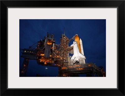 Night view of space shuttle Atlantis on the launch pad at Kennedy Space Center, Florida