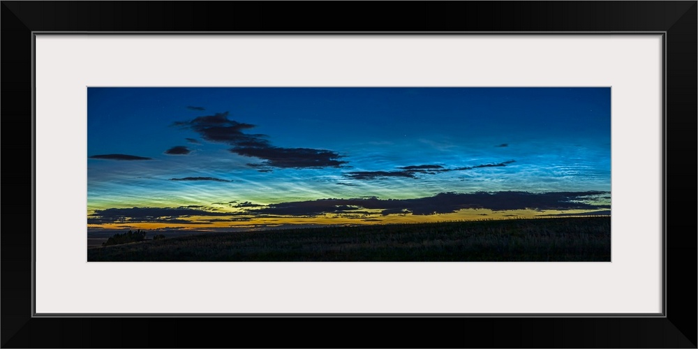 A 45 degree panorama of noctilucent clouds seen the night of June 1-2, 2020 in Alberta, Canada, first at dusk and then lat...