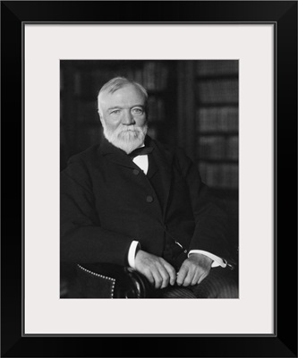 Portrait of Andrew Carnegie seated in a library