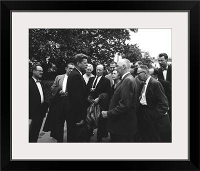 President John F. Kennedy visits with reporters