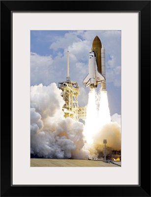 Space Shuttle Atlantis lifts off from its launch pad